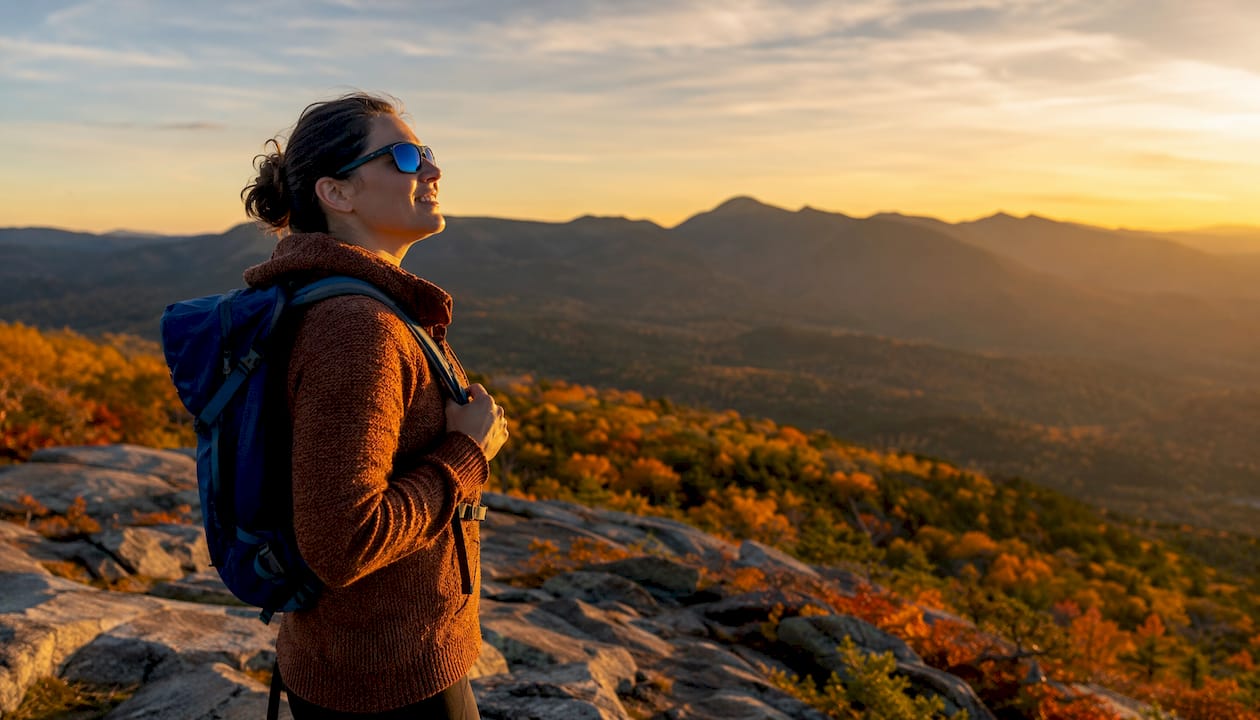 Woman outdoors wearing color-enhancing sunglasses